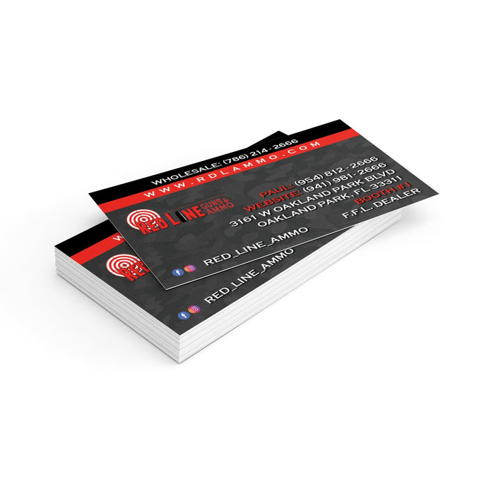A stack of standard business cards with a red and black design, including company name, logo, and contact information.