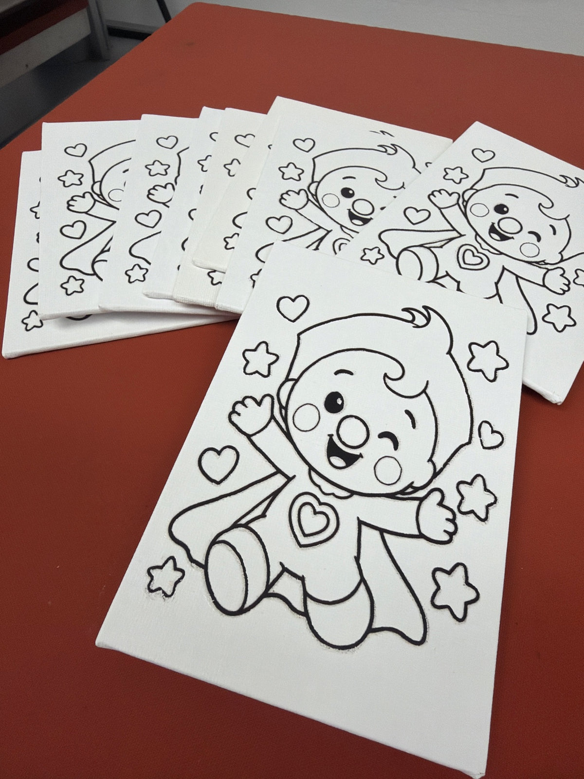 Stack of 4x6 custom outline canvases for a birthday party